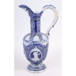 A Rhenish stoneware ewer, decorated relief panels with figures and acanthus leaves (chip to handle)