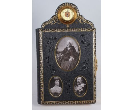 A late Victorian tooled gilt leather easel carte de visite album with clock surmount