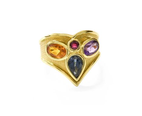 A Multi-Gem Set Ring, the pear cut sapphire and round cut ruby flanked by an oval cut citrine and an oval cut amethyst, in ye