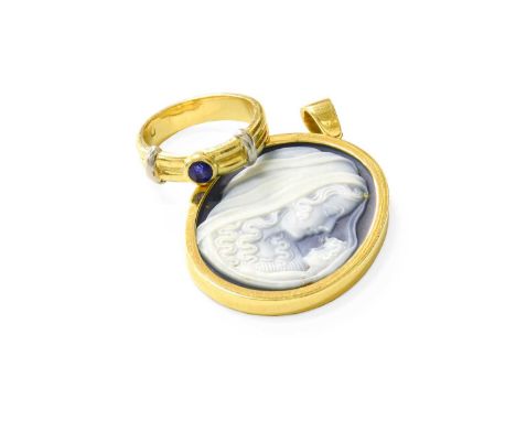 A Hardstone Cameo Pendant, the cameo depicting Madonna and Child, in a yellow plain polished frame, measures 3.6cm by 2.8cm; 