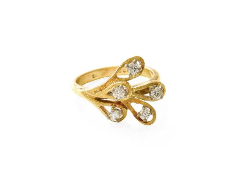 An 18 Carat Gold Diamond Ring, modelled as a stylised spray, five round brilliant cut diamonds in white claw settings, within