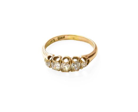 A Diamond Five Stone Ring, the graduated old cut diamonds in yellow claw settings, to a tapered shoulder plain polished shank