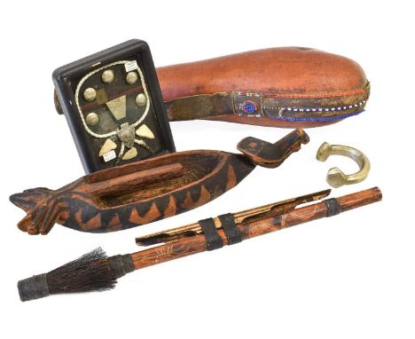 A Maasai Gourd Flask, with leather cover and attached leather strap decorated with coloured glass beads; an Indonesian Carved