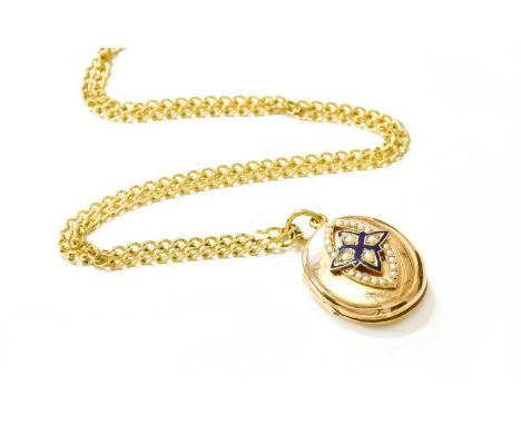 An Enamel and Split Pearl Locket on Chain, the oval locket with central quatrefoil motif set throughout wth split pearl and e