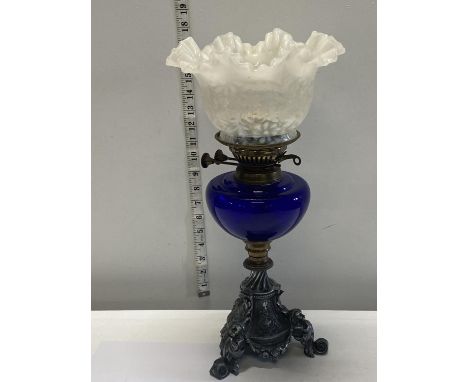 A nice quality Victorian oil lamp with a blue glass reservoir and milk glass shade. 43cm tall.  shipping unavailable 