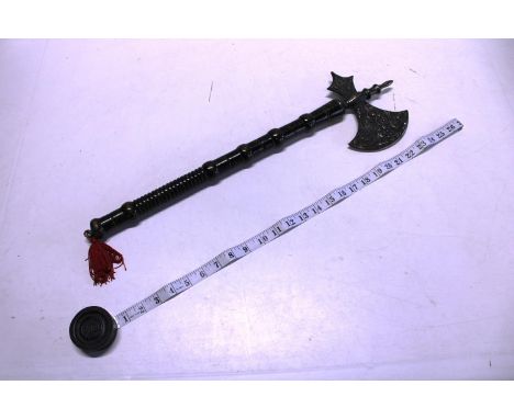 A wall hanging medieval style axe 