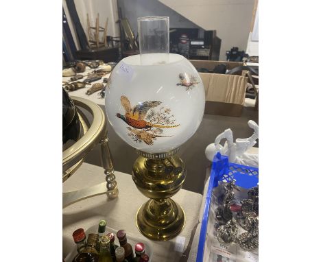 A vintage brass and glass oil lamp with pheasant decoration to the glass shade.  shipping unavailable 