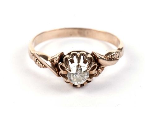 A Victorian old cut diamond solitaire ring, the openwork rose gold setting on twist shoulders, stamped indistinctly, size M, 