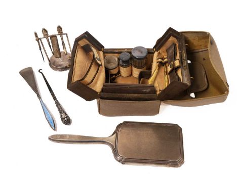A selection of dressing table and vanity items to include: a manicure set with silver mounts on desk stand; a silver backed d