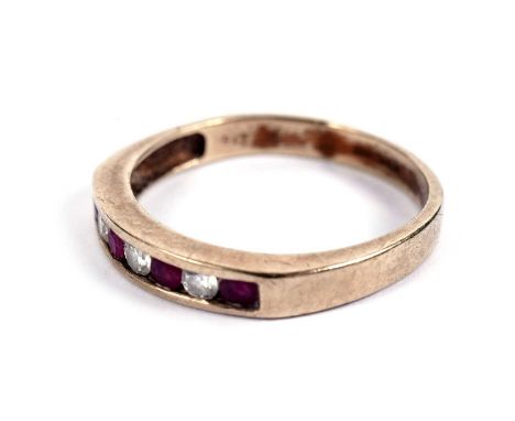 A ruby and diamond half hoop eternity ring, in 9ct yellow gold, size O 1/2, 2.2g gross.