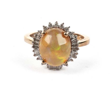 An opal and diamond ring, in 9ct yellow gold mount and shank, ring size R, 5.1g gross.