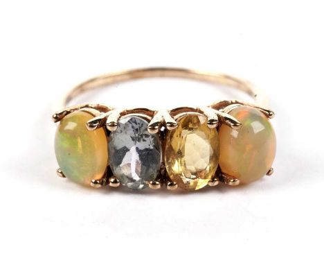 A water-opal and gem-stone ring, probably quartz, in 9ct yellow gold mount and shank, ring size S, 2.8g gross.