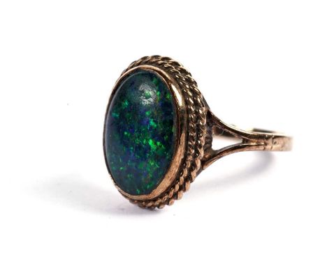 An opal ring, doublet or triplet, in 9ct yellow gold mount, ring size S, 4.5g gross.