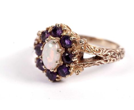 An amethyst and opal dress ring, of antique style, on a 9ct gold shank, size K, 3.5g gross.