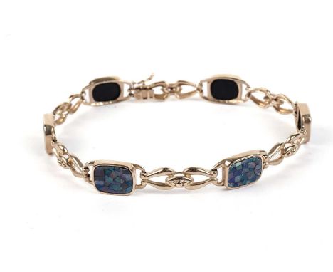 A composite opal and 9ct yellow gold bracelet, with six panels, 19.5cms long, 11.9g gross.