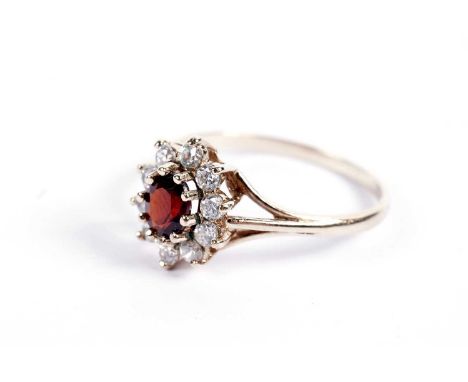 A red tourmaline and paste cluster ring, on a 9ct gold shank, size L, 1.6g gross.
