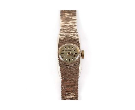 A lady's 9ct gold Rotary cocktail watch, with circular brushed dial, baton markers, bark-effect tonneau case, and matching 9c