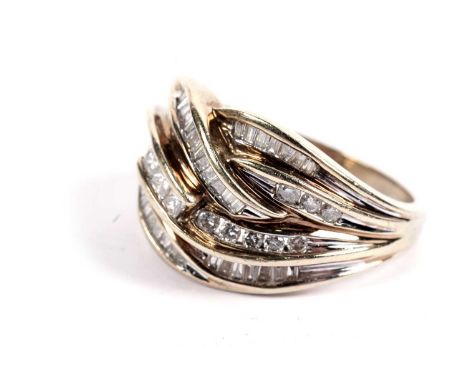 A diamond dress ring in an entwined knot pattern, set with three princess cut, 16 round brilliant cut, and 50 tapered baguett