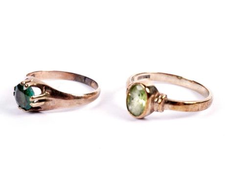 A single-stone peridot ring, on 9ct gold shank, ring size L; and an emerald ring, on gold shank, ring size I, 3.4g gross.