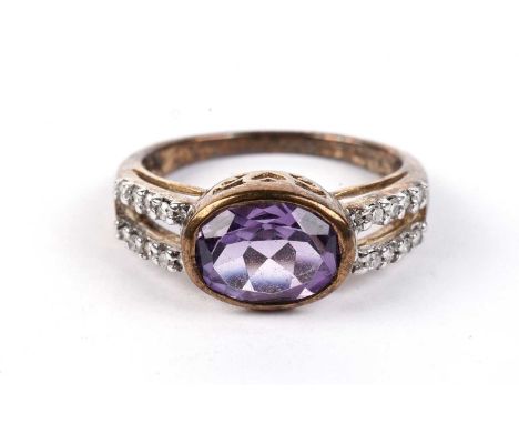 An amethyst and diamond dress ring, in 9ct yellow gold mount and shank, ring size N, 2.7g gross.