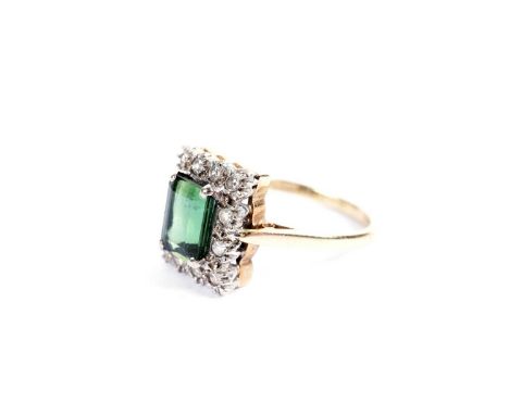 A green tourmaline and diamond ring, in 18ct yellow gold, size O 1/2, 4.5g gross.