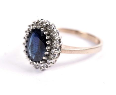 A sapphire and diamond cluster ring, in 9ct yellow gold, size P, 3.6g gross.