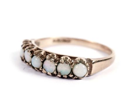 A seven-stone opal ring, in yellow gold, stamped "9C", size P 1/2, 2.2g gross.