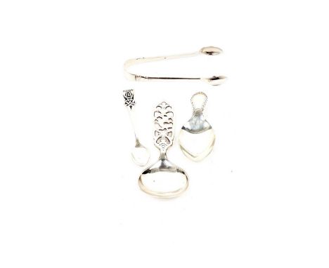 A salt spoon by John Hart, Edinburgh and Iona, with Celtic scroll design; a bright-cut caddy spoon by Thomas Bradbury and Son