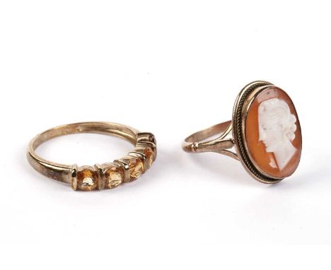 A five-stone citrine ring, in 9ct gold mount and shank, ring size R; and a carved shell cameo ring, the gold shank stamped "7