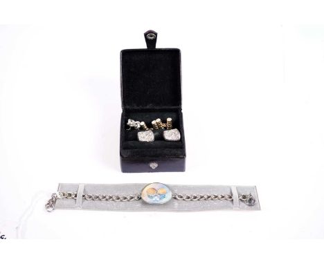 An enamelled silver bracelet, with circular disc enamel decorated with table tennis rackets and balls, 22cms long; a pair of 