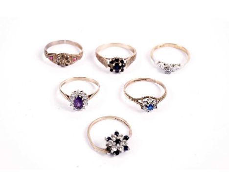 A solitaire diamond ring, in platinum setting and 18ct gold shank, size N, 2.7g gross; and a selection of gemstone rings, inc