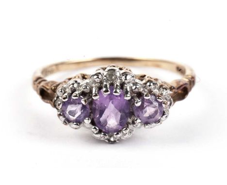 An amethyst and diamond cluster ring, in 9ct yellow gold mount and shank, ring size K, 1.9g gross.