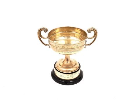 A silver trophy cup ‘Reed Print &amp; Design the Scottish Cup’ by William Hutton and Sons, Birmingham, 12.7oz, on ebonized ba