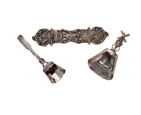 A Dutch silver windmill pattern caddy spoon; another caddy spoon, with shaped handle and bowl; and a three-part belt buckle, 