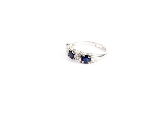 A sapphire and diamond half hoop eternity ring, in 9ct white gold, size H, 2.1g gross.