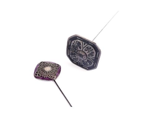 A silver and enamel hat pin, of swivel plaque form; and another.