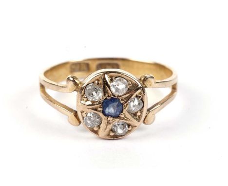 A sapphire and diamond cluster ring, in star mount, in 18ct yellow gold mount and shank, ring size M, 2.0g gross.