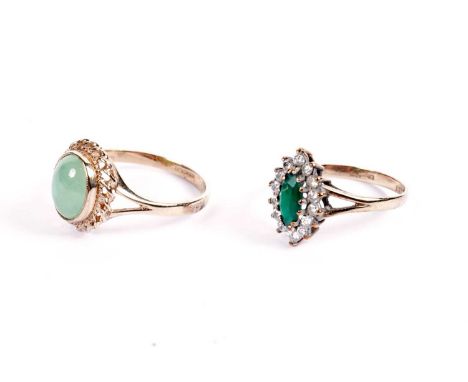 A jade-coloured stone ring; and a green and white stone cluster ring, each in 9ct yellow gold mount and shank, ring size N/K,