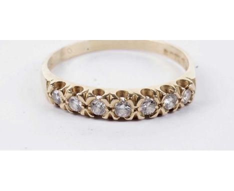 A seven-stone diamond ring, in 18ct yellow gold, size Q, 2.7g gross.