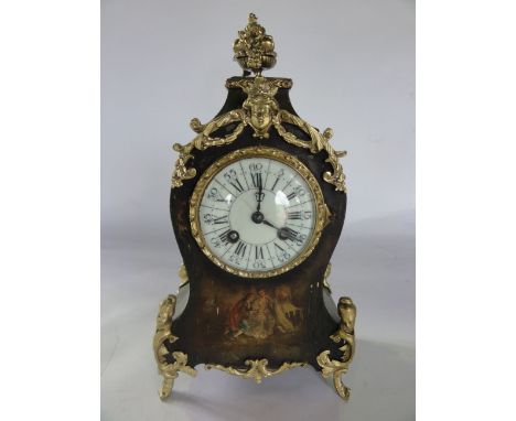 A 19th century French mantle clock, the painted timber case showing a romantic scene - overlaid with cast and gilded mounts w