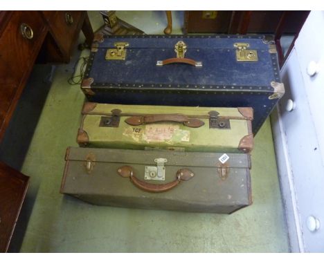 Three vintage canvas and leather reinforced suitcases of varying design, together with a vintage fibre and timber lath bound 
