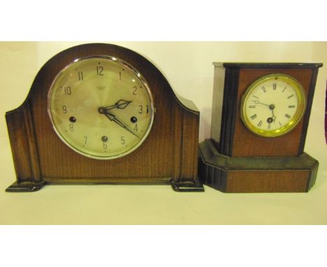 A small Victorian walnut and ebonised mantle clock with 8 day timepiece and one further clock