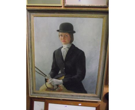 A 20th century oil painting on canvas, half length portrait of a young woman in riding dress with bowler hat, black jacket an