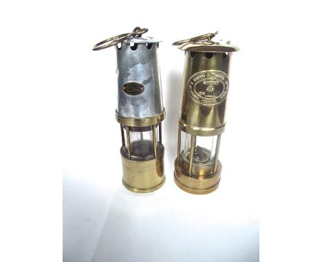 A brass cased miners lamp bearing plaque E.Thomas & Williams Ltd makers Aberdare, Wales, Cambrian No16304, also marked E T W 