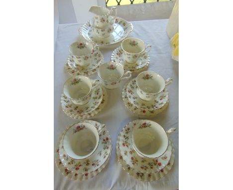 A collection of Royal Albert Winsome pattern teawares, comprising milk jug, sugar bowl, cake plate, seven cups, six saucers a