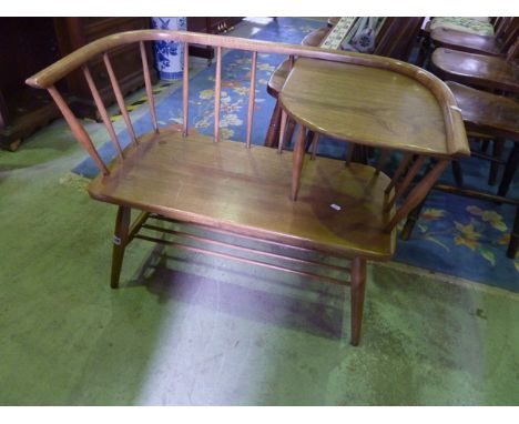 An Ercol style elm and beechwood stick back telephone seat, labelled Chippy Heath Furniture