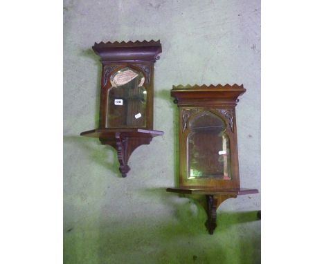 A pair of small late Victorian wall shelves/brackets, the raised backs incorporating Moorish style bevelled edged plates over