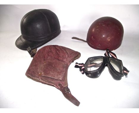 A 20th century "centurion helmet" with further automobile helmet, goggles, leather cap, etc, 20th century automobile effects 