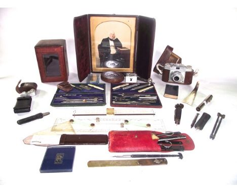 A miscellaneous collection to include a coloured Victorian photograph of a seated gentleman set within a folding leather fram