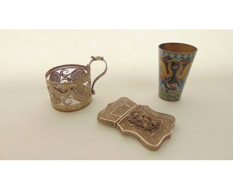 A Chinese cloisonne enamel brass cup, with dragon decoration; a white metal tea glass holder, with filigree decoration; and a